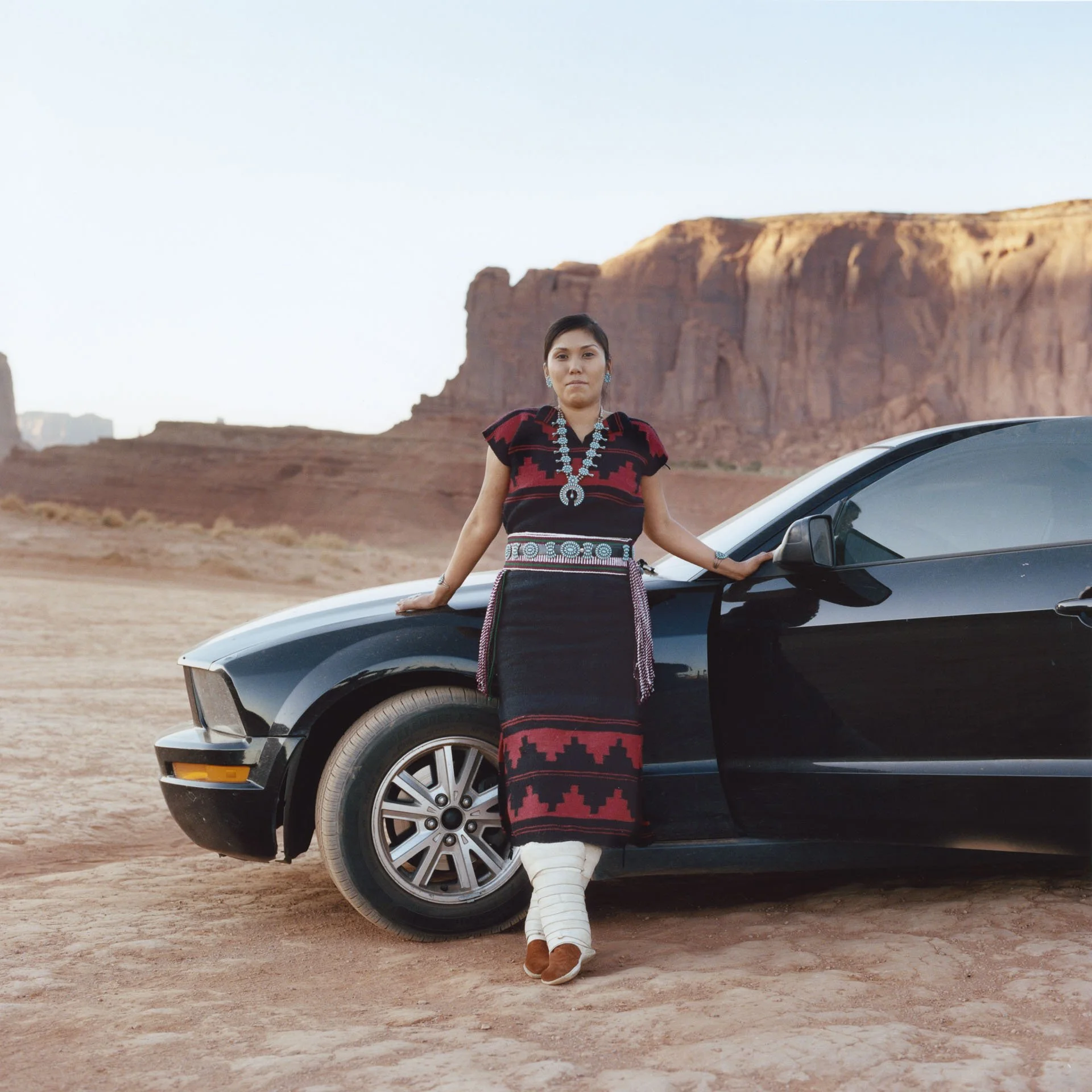 Evereta and her Mustang: photographed in Tse’Bii’Ndzisgaii (Monument Valley) with her Ford Mustang. She is a Diné (Navajo) woman working in the education system with hopes of one day opening up a cultural and language immersion school for her people.