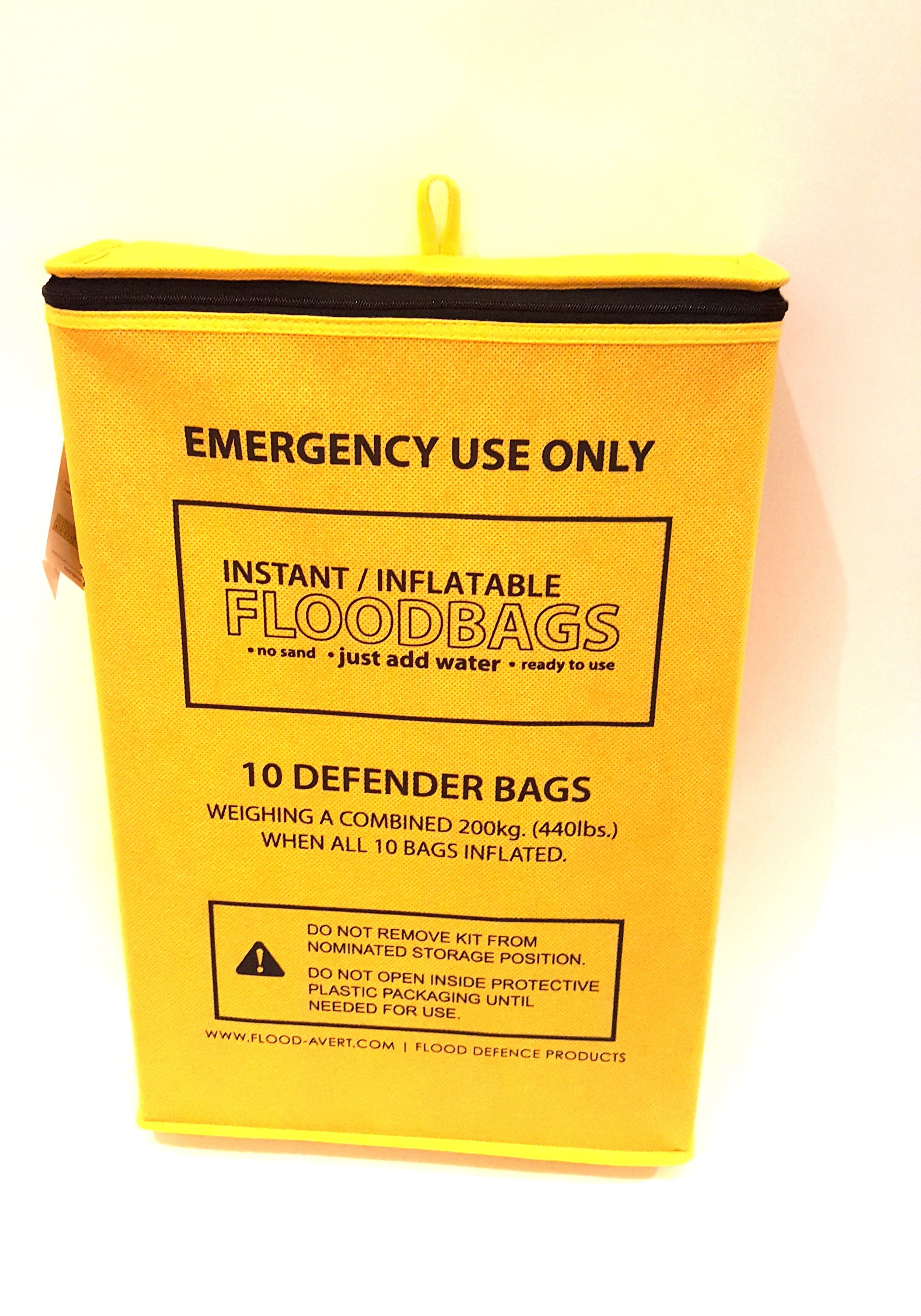 Yellow emergency flood storage bag labeled 'INSTANT INFLATABLE FLOODBAGS' containing 10 bags, with instructions for use and safety warnings.