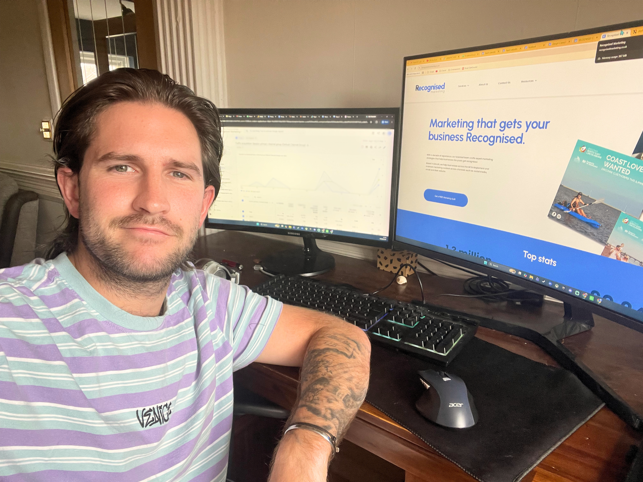 Jacob, Recognised Marketing's Founder, sat at his desk with our website and marketing analytics on his monitors