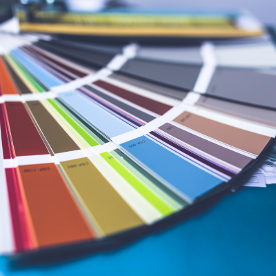 multiple colour samples on a table for a designer picking a colour palette