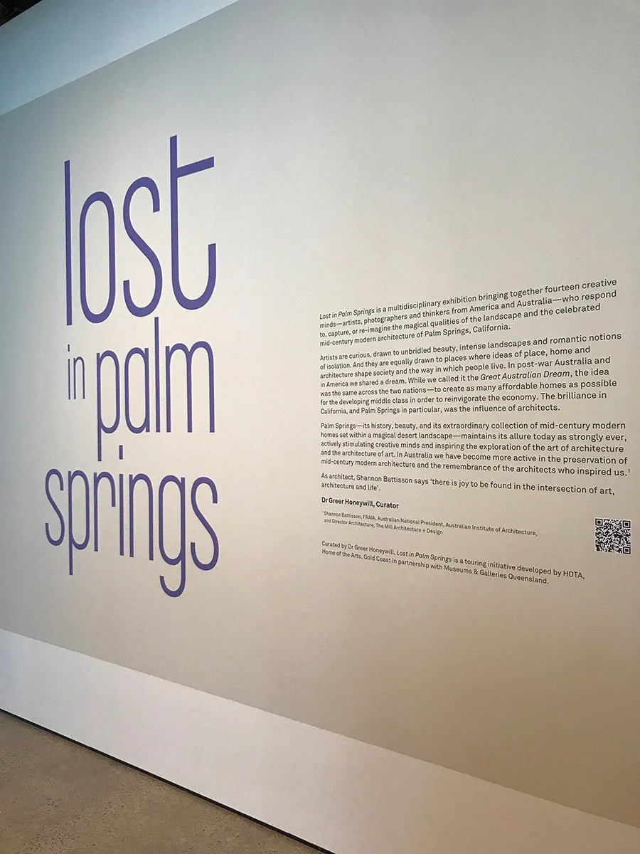 Exhibition title 'Lost in Palm Springs' with descriptive text about the exhibit, mention of Palm Springs' modern architecture, artistic inspiration, and cultural significance.