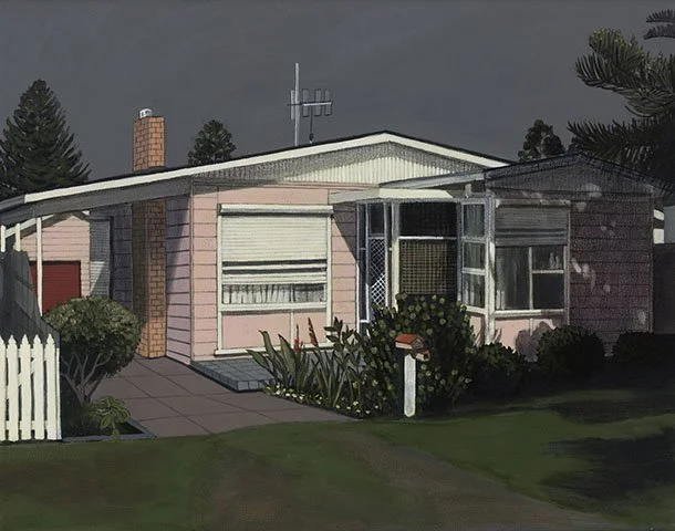 A single-story house with a pink exterior, a white garage door, and a small front porch surrounded by greenery under a dark, cloudy sky.