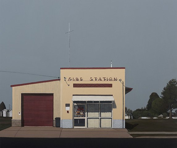 A small building with a sign that reads 'FARIBE STATION' and a closed garage door, possibly a train or bus station.