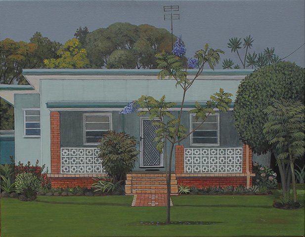 A suburban house with a small front porch, surrounded by green lawn and trees, including a small flowering tree in the foreground.