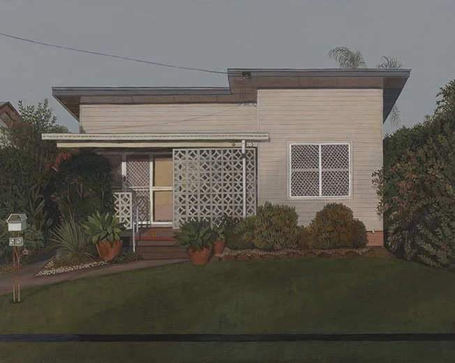 Front of a house with a small front garden, potted plants, bushes, a window, and a decorative front gate.
