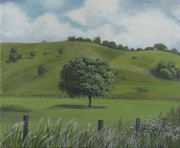 A painting of a green landscape with rolling hills, scattered trees, a large central tree, and a cloudy sky.