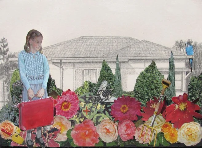 A young girl in a blue sweater standing in front of large pink, red, orange, and cream flowers with a garden and house in the background.