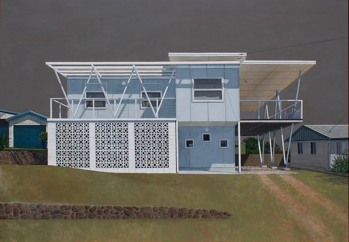 Modern two-story house with unique architectural design, white and gray exterior, large balcony, and geometric support structures, situated on a grassy hillside.