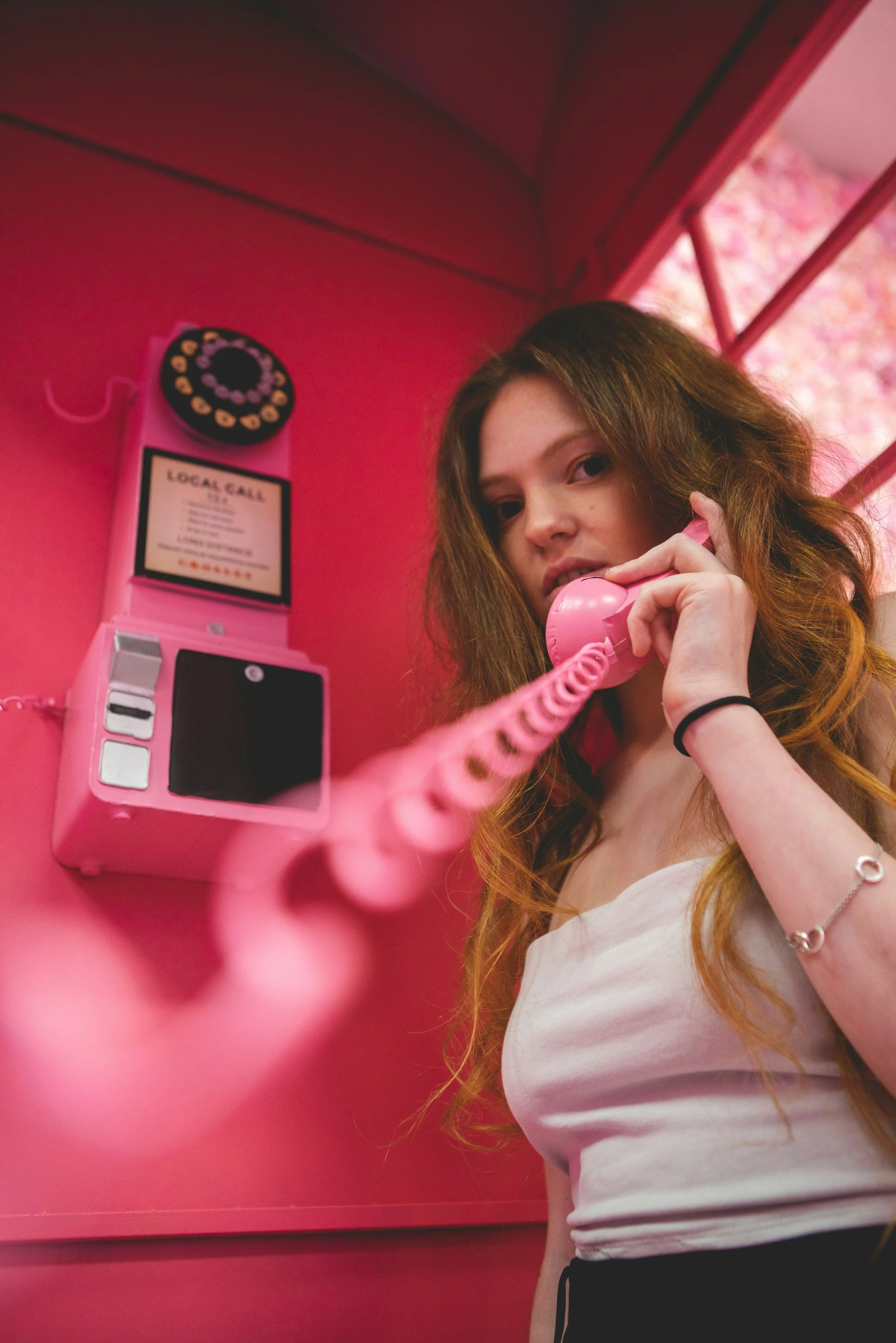 College teen using telephone