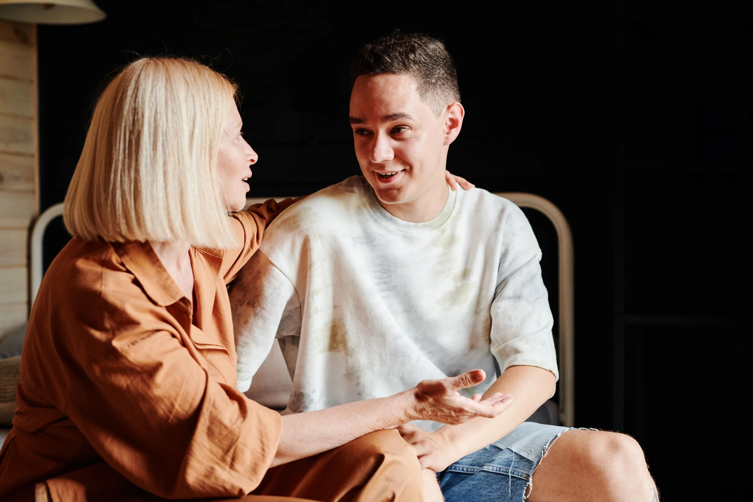 A parent and young person sitting together