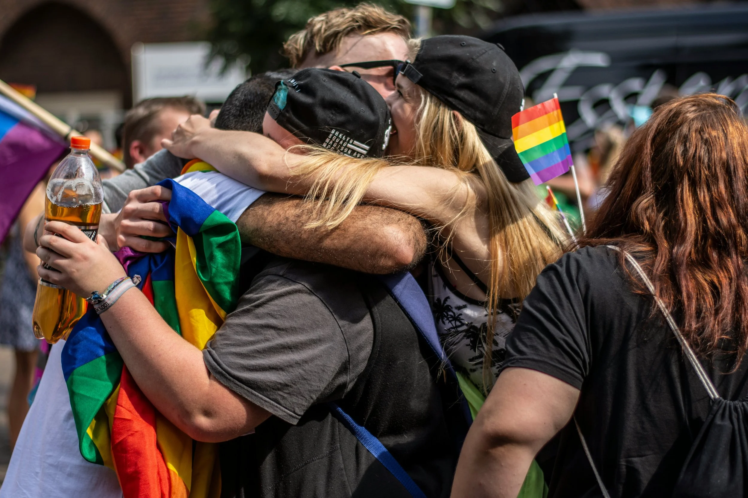 person surrounded by affirming community — warm, vibrant, a sense of belonging