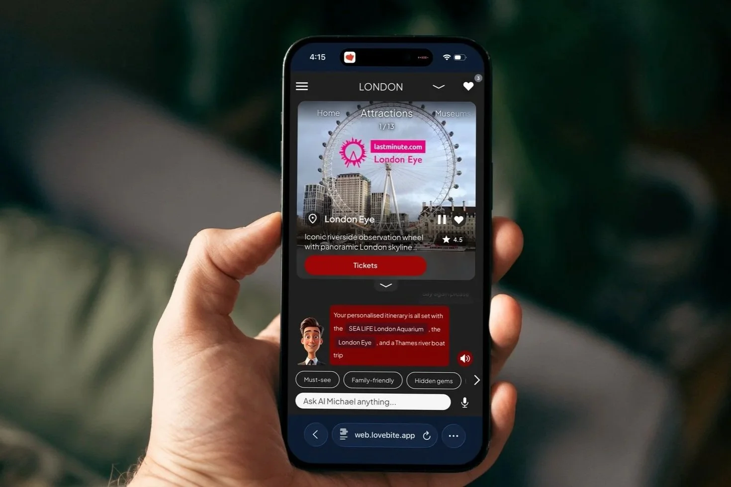 A hand holding a smartphone showing the London V-Guide with London Eye content.