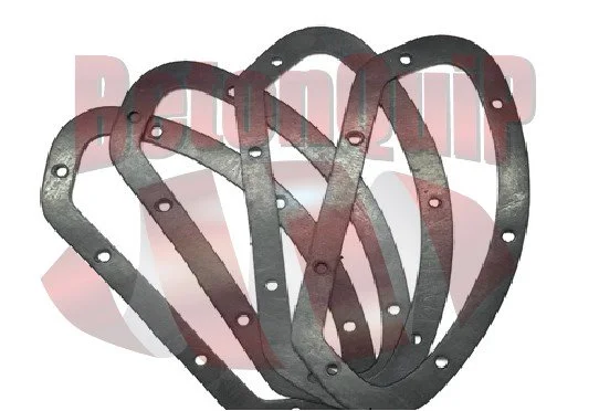 Four metal engine head gaskets overlapping each other on a white background.