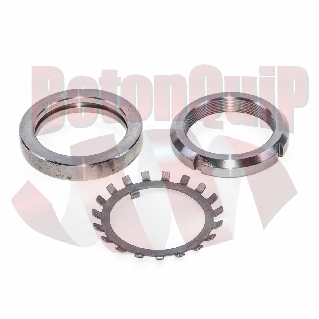 Three metal mechanical parts, including two bearing rings and a lock washer, arranged on a white background.
