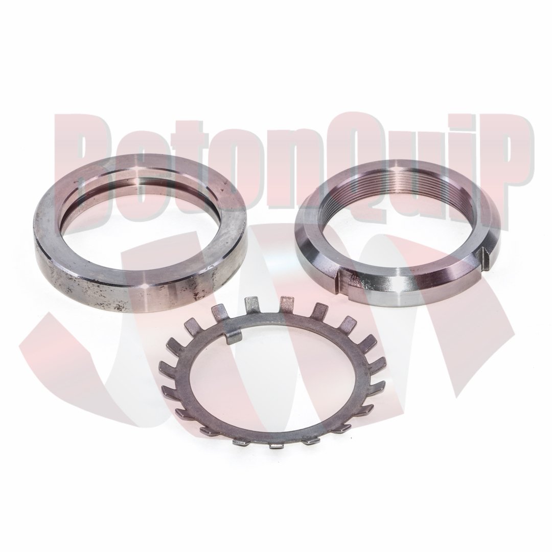 Set of metallic mechanical spacers and washers on a white background.
