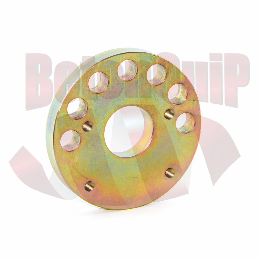 Metallic automotive wheel spacer with multiple bolt holes facing forward.