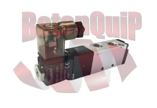 Close-up of a pneumatic or hydraulic valve with metal and plastic parts, connected to a metallic fitting, against a plain background.