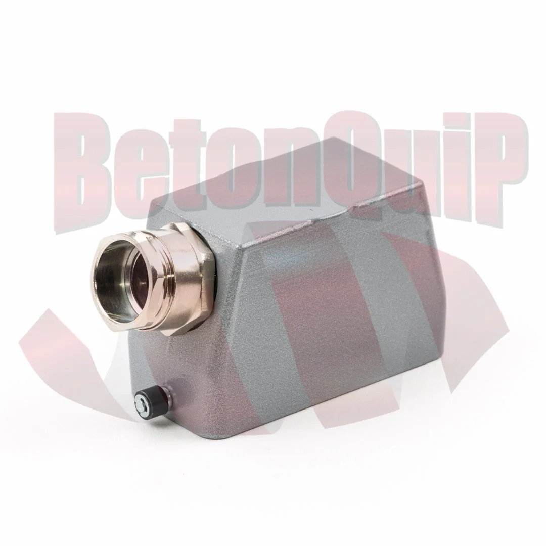 A metallic gray, rectangular, industrial device with a circular connection port on one side and a small black knob on the other.