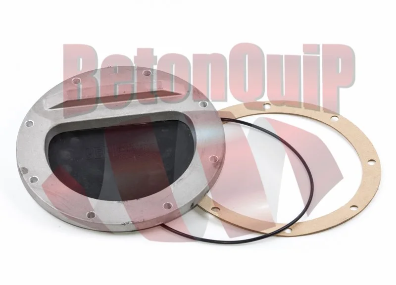 Automotive car part with a metal housing, a transparent cover, and two gaskets, one black rubber and one beige gasket, placed on a white background.