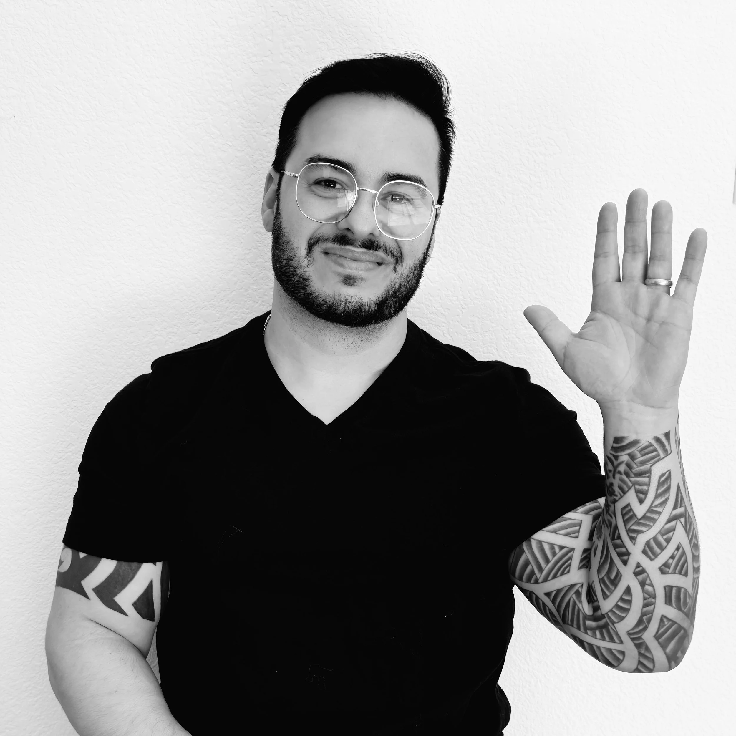 An accent training coach gesturing with an open hand, welcoming new students to an accent modification program.