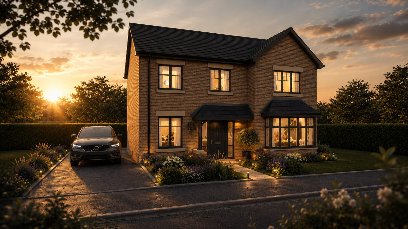 A two-story brick house at sunset with lit windows, a black front door, a driveway with a parked black Volvo car, and a well-maintained garden with flowers and landscape lighting.