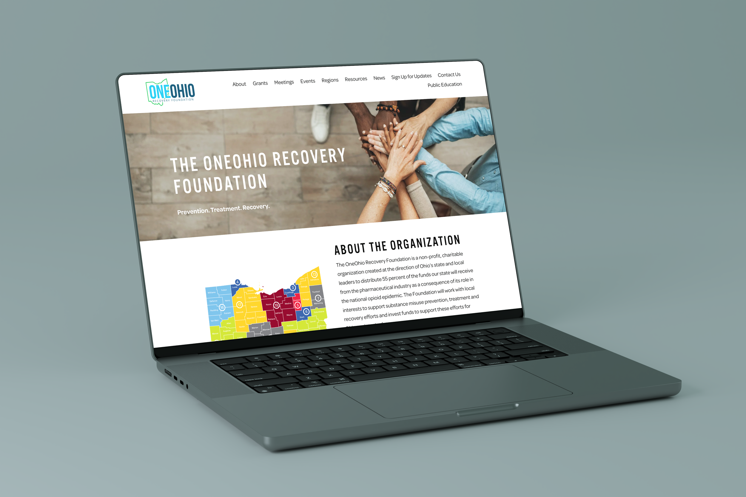 Laptop mockup showing custom responsive web design and branding for One Ohio Recovery Foundation