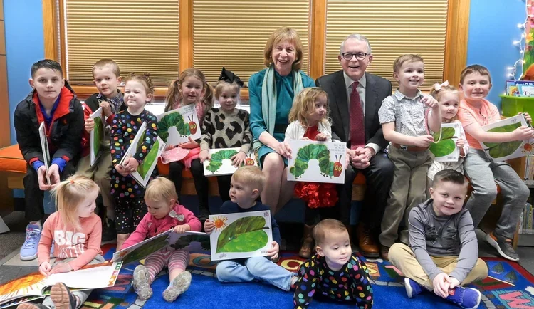 Ohio Governor Mike DeWine and First Lady Fran DeWine with children and books for the Imagination Library campaign by Trust Digital