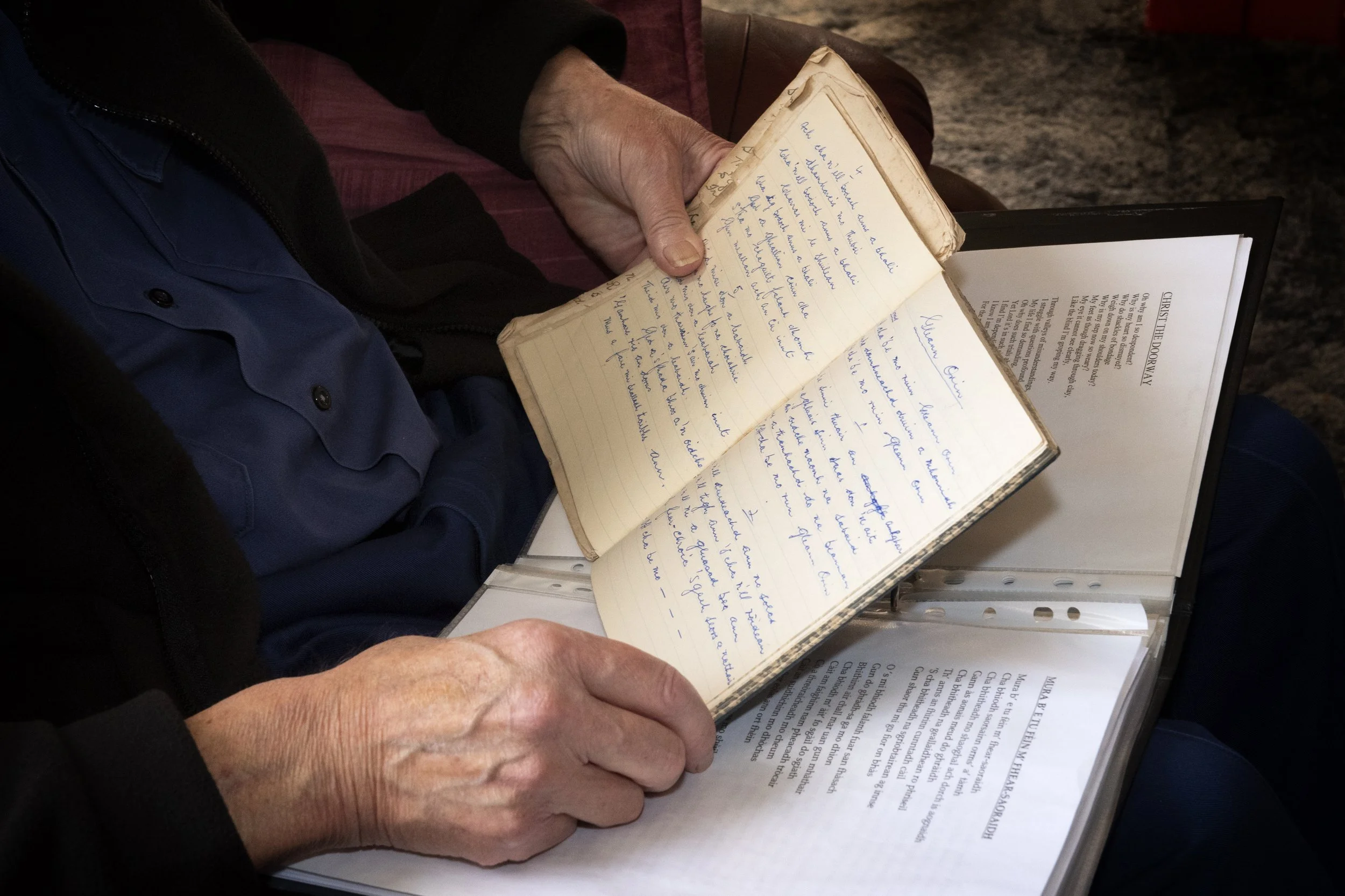 Murdo John Morrison with a book of hand-written hymns. Fivepenny, Ness, Lewis. October 2022. Photo by Mairi M Martin. 