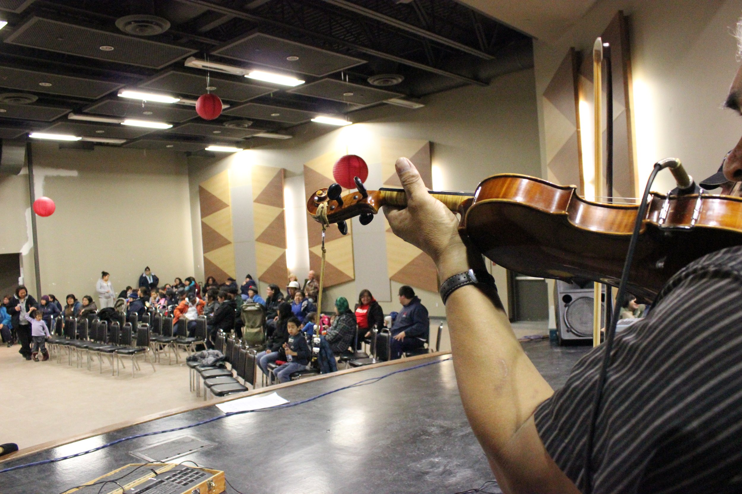 James Stewart performing in Wemindji, Eeyou Istchee, Québec. November 2011. Photograph by Frances Wilkins.