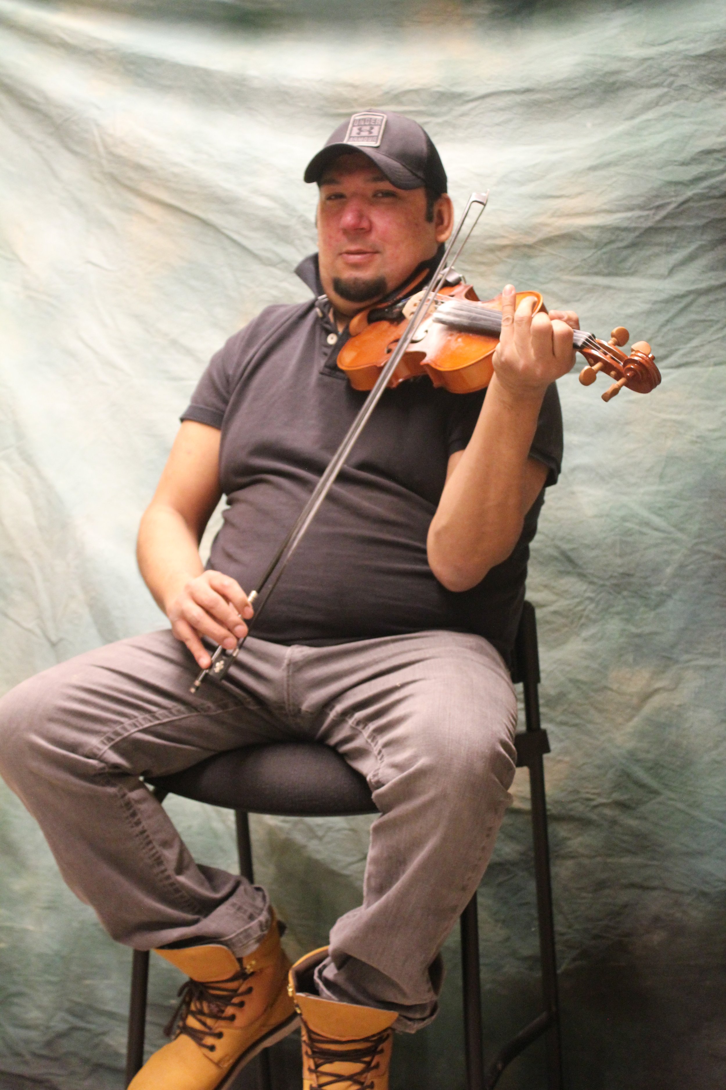 Byron Jonah, fiddler, Waskaganish, Eeyou Istchee, Québec. March 2018. Photograph by Frances Wilkins.