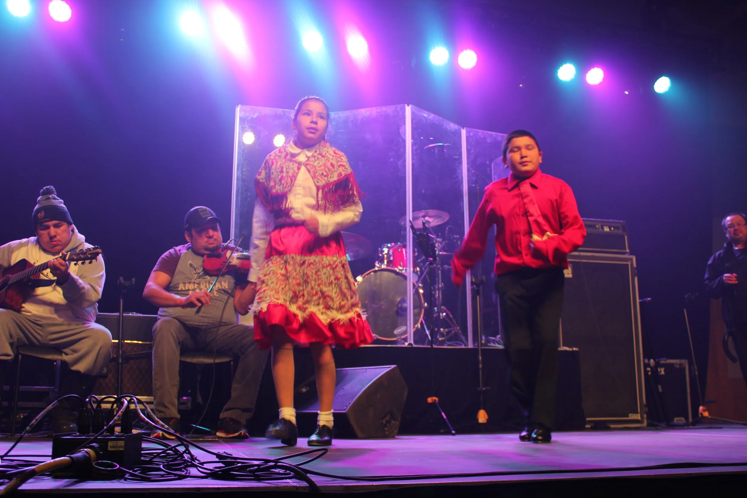 Stepdancers performing in Waskaganish, Eeyou Istchee, Québec. March 2018. Photograph by Frances Wilkins.
