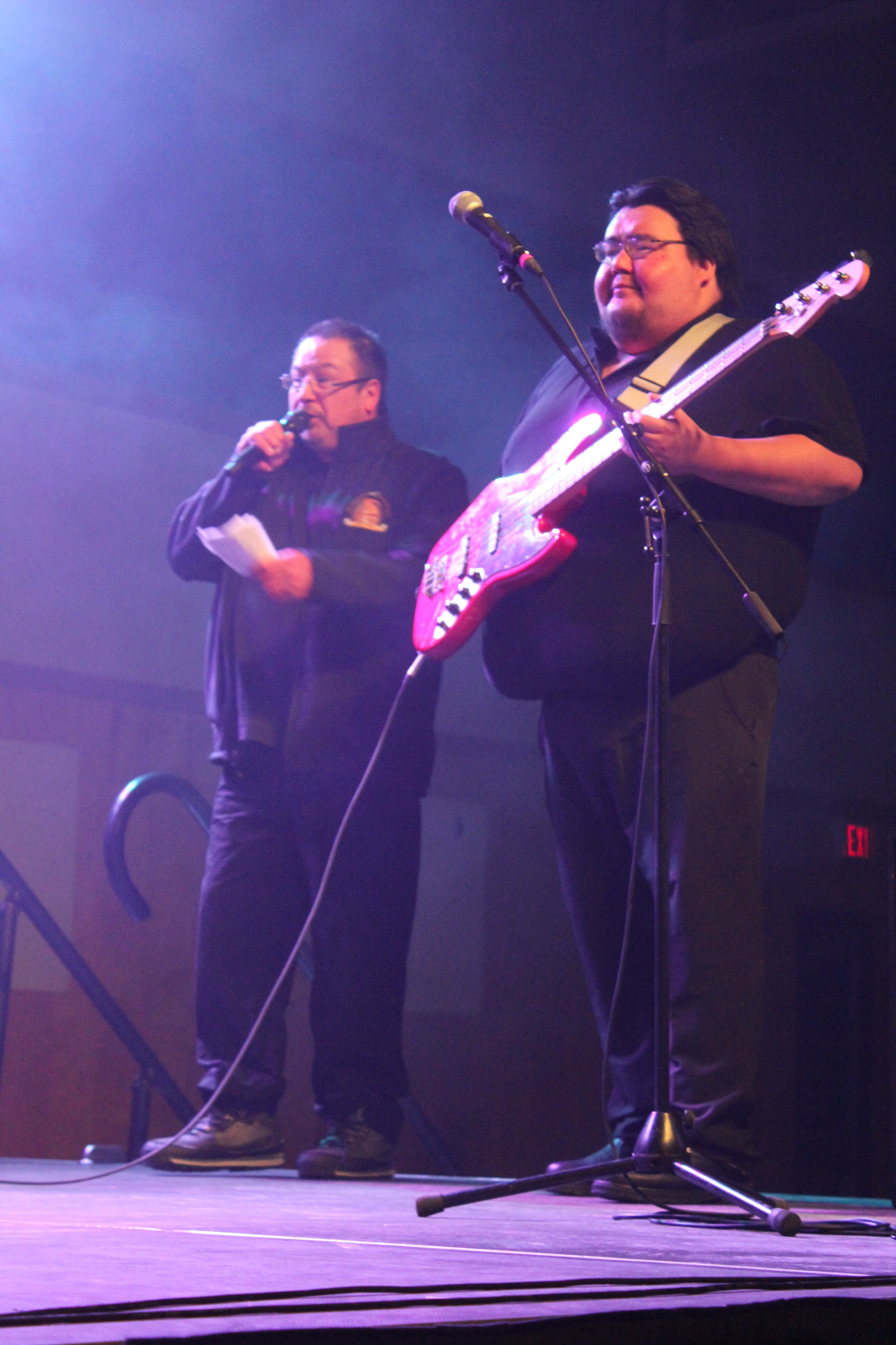 Musician and MC on stage in Waskaganish, Eeyou Istchee, Québec. March 2018. Photograph by Frances Wilkins.