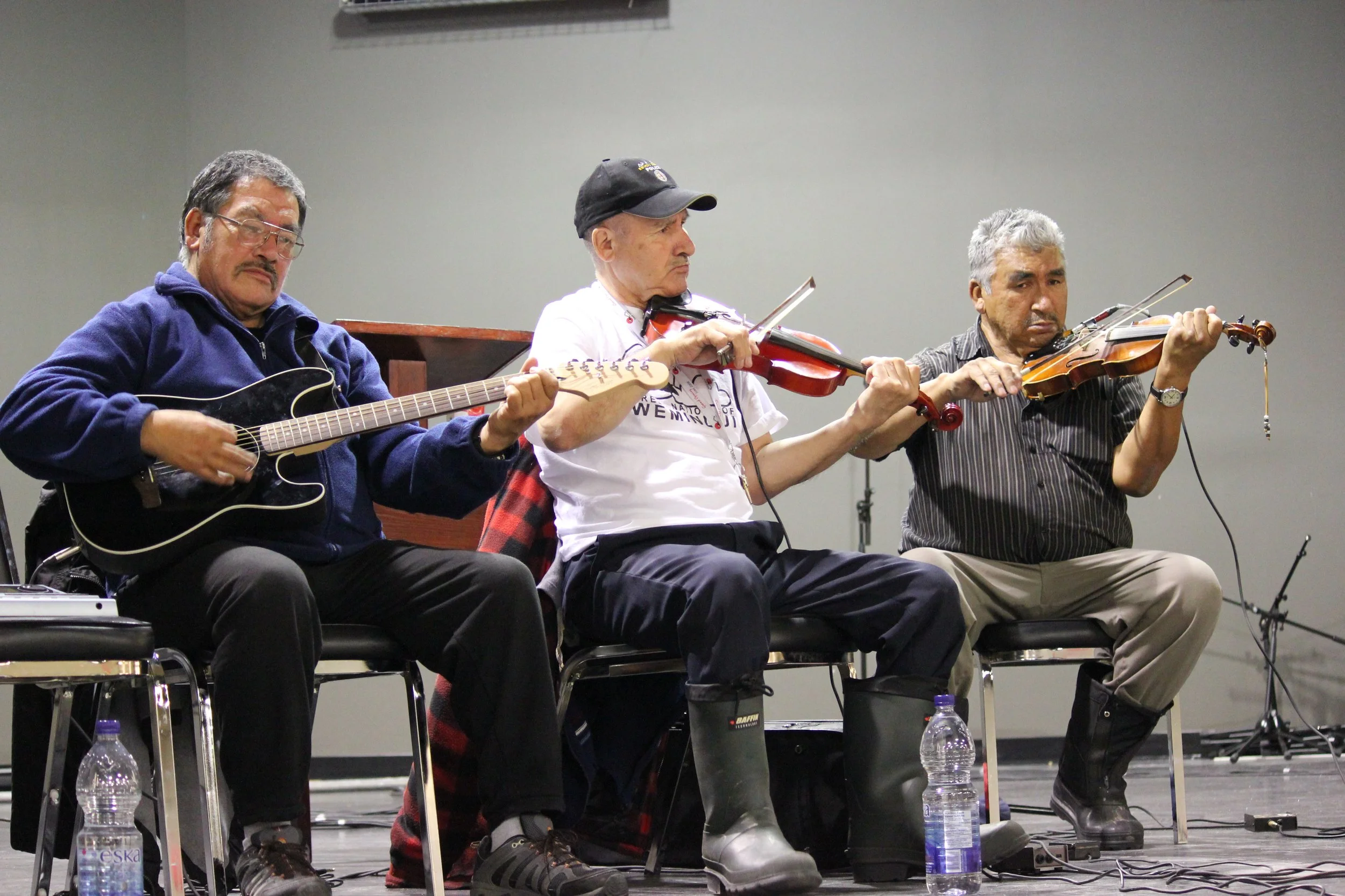 David Kakabat, Bobby Georgekish and James Stewart performing in Wemindji, Eeyou Istchee, Québec. November 2011. Photograph by Frances Wilkins.