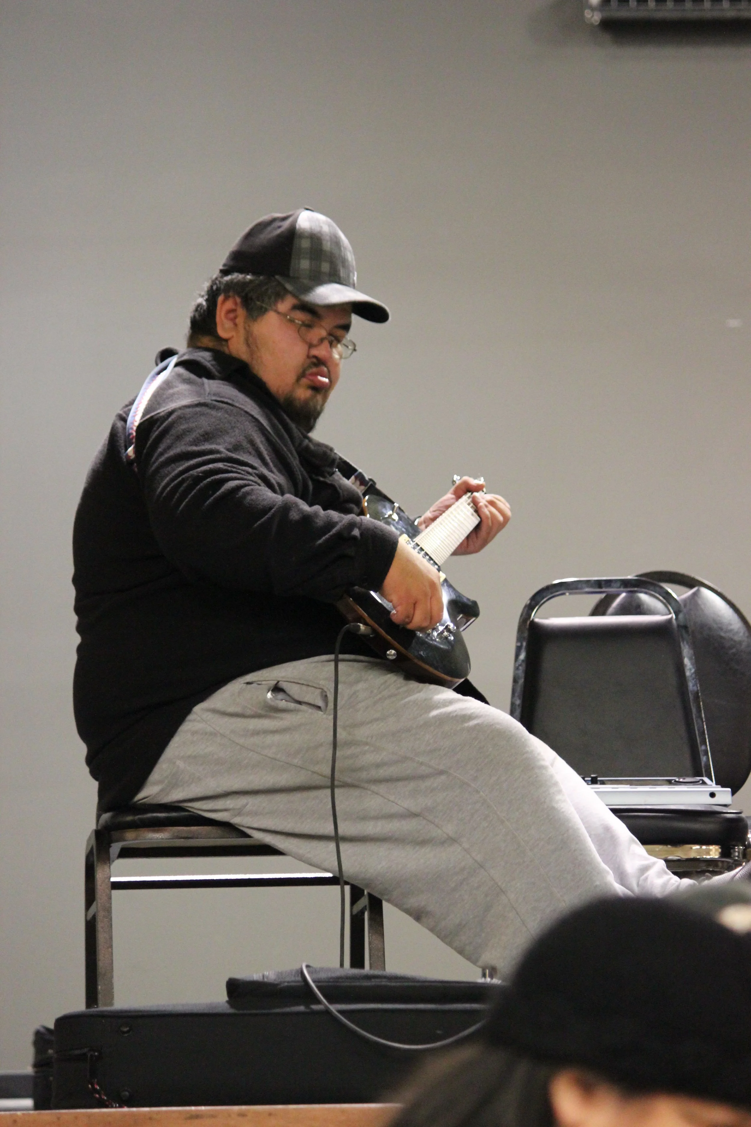 Electric guitarist performing in Wemindji, Eeyou Istchee, Québec. November 2011. Photograph by Frances Wilkins.