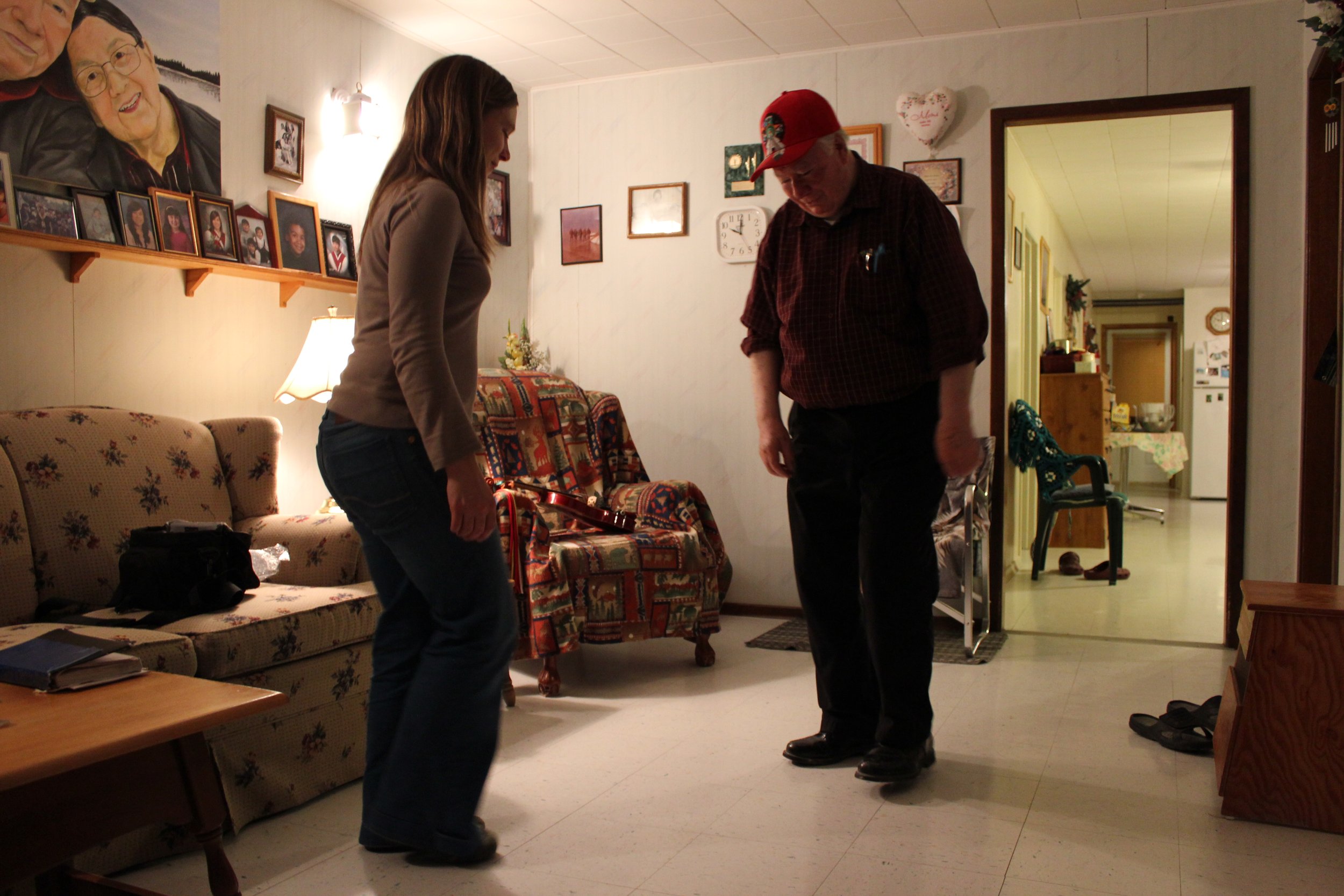 Frances dancing with James Cheechoo, fiddler, Moose Factory, Northern Ontario, December 2011. Photograph by Frances Wilkins. 