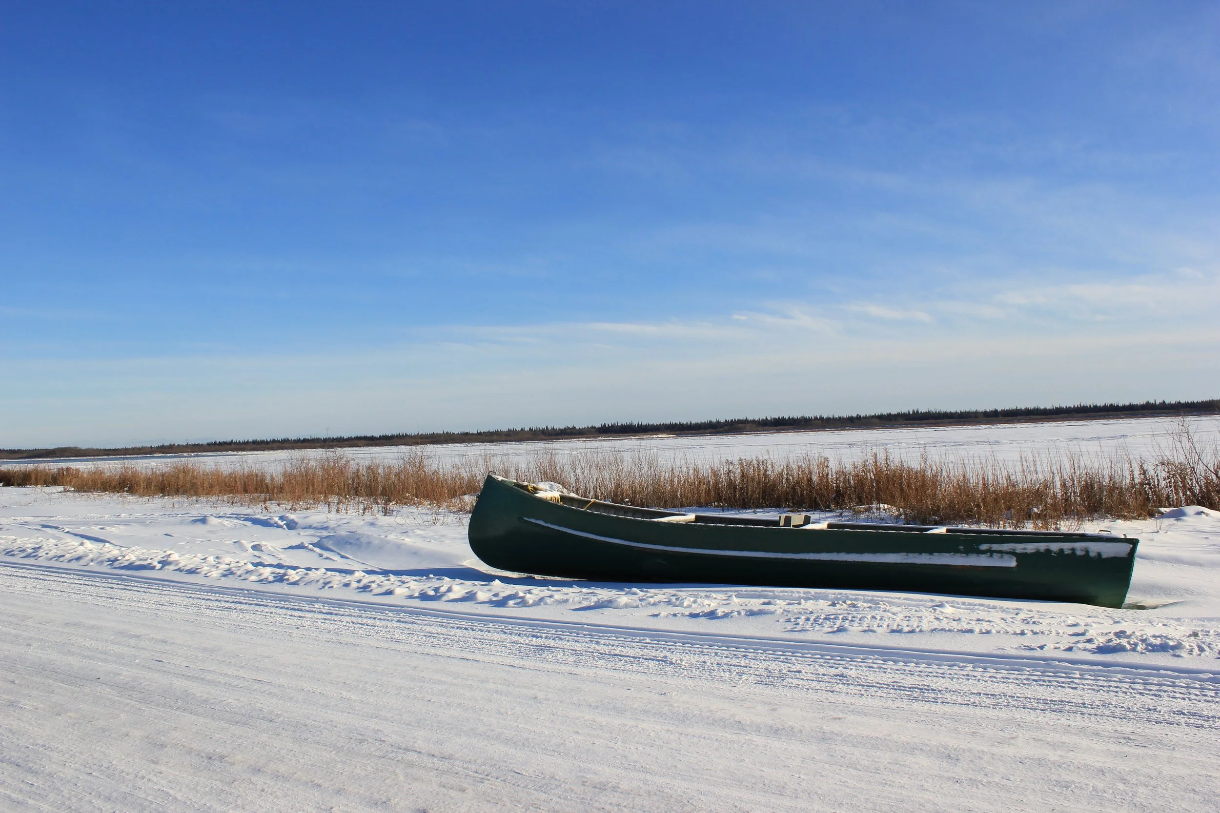 Canoe next to the Moose River, Moose Factory, Northern Ontario, December 2011. Photograph by Frances Wilkins. 