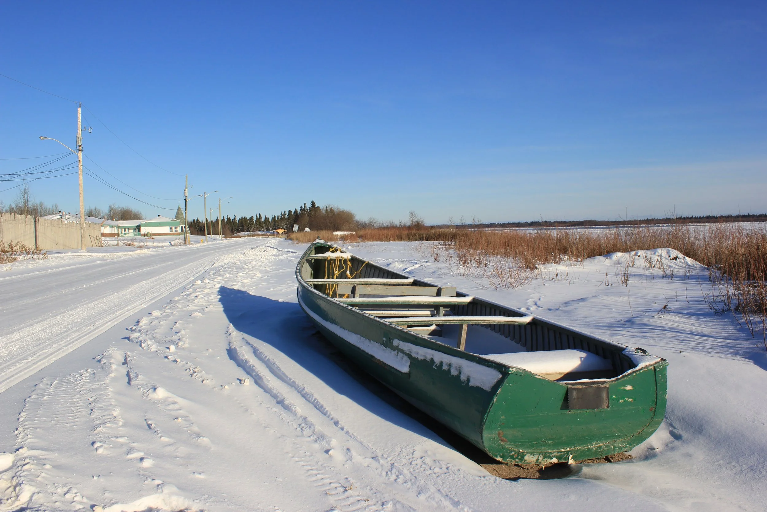 Canoe next to the Moose River, Moose Factory, Northern Ontario, December 2011. Photograph by Frances Wilkins. 