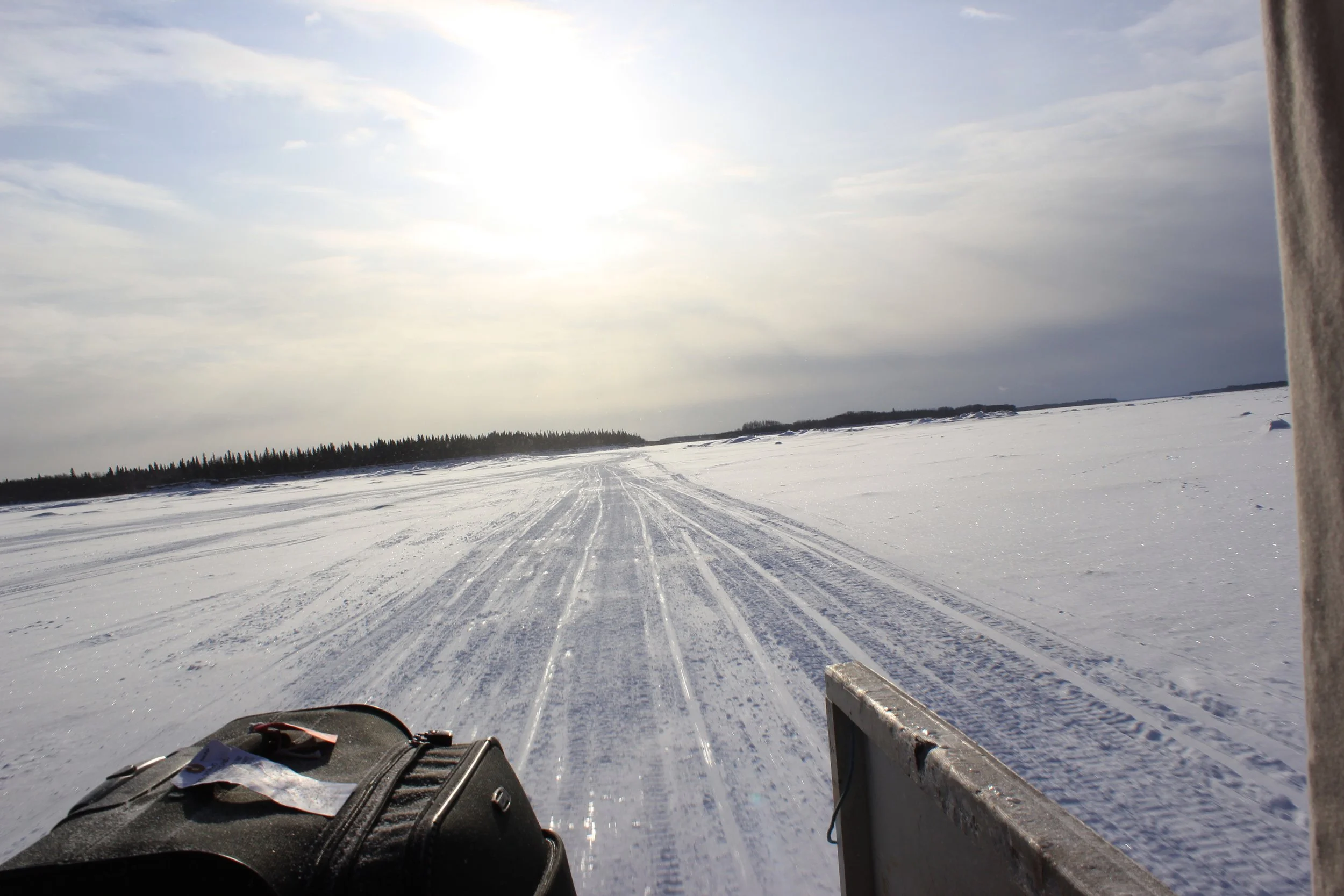 From a ski-doo taxi, Ice road between Moose Factory and Moosonee, Northern Ontario, December 2011. Photograph by Frances Wilkins. 