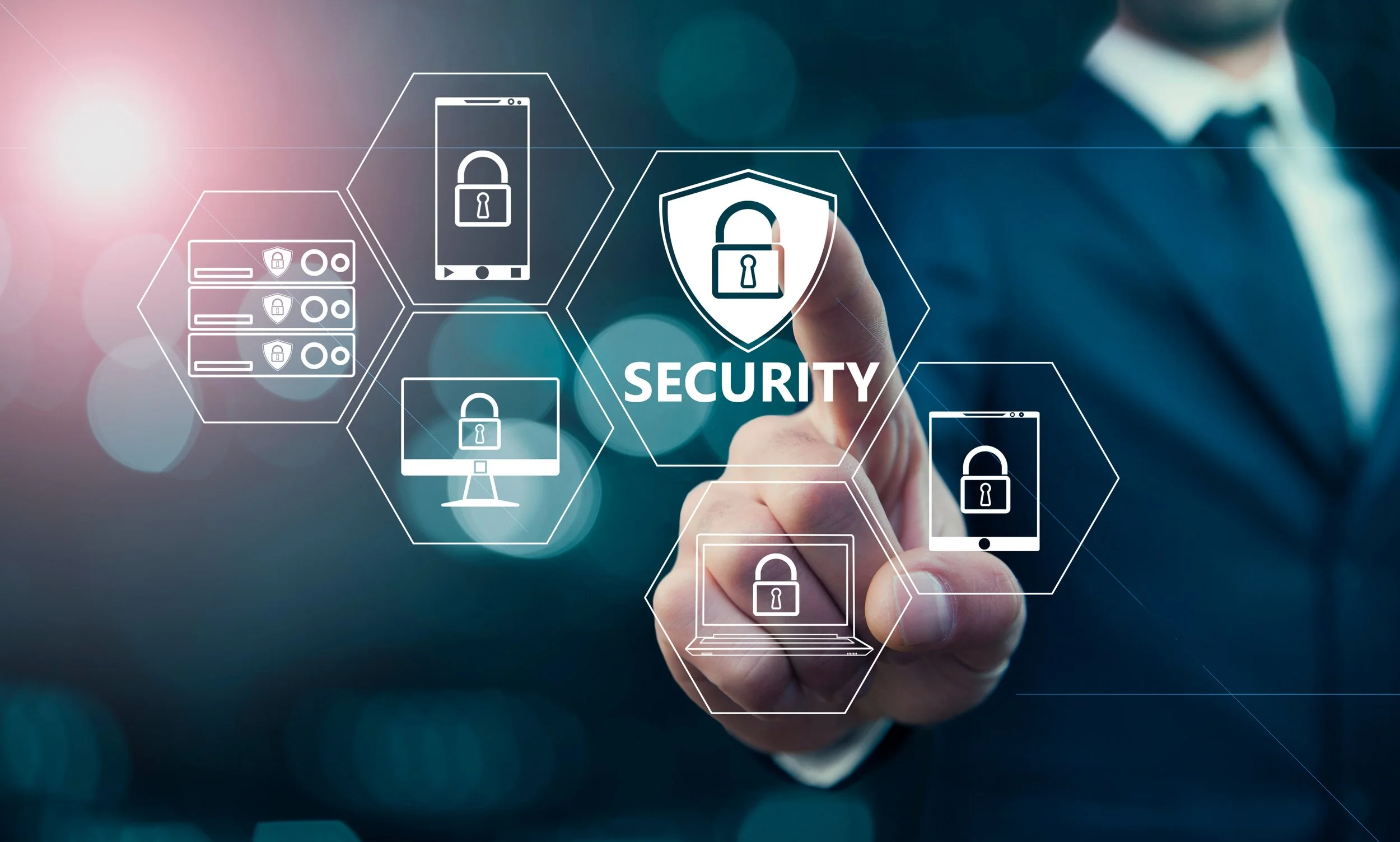 A person in a business suit interacts with digital icons representing security, including locks, a shield, a smartphone, a computer, and a server, set against a blurred background.