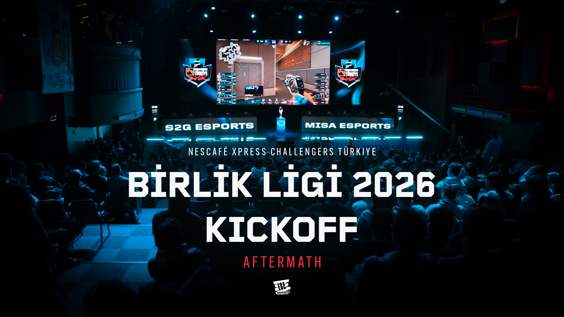 An esports event with a large crowd watching a stage with screens displaying a first-person shooter game. Text on the stage reads 'S2G Esports', 'MISA Esports', and 'Nescafe Xpress Challengers Turkey Birlik Ligi 2026 Kickoff.' The scene is dark with blue lighting, and the audience is seated facing the stage.