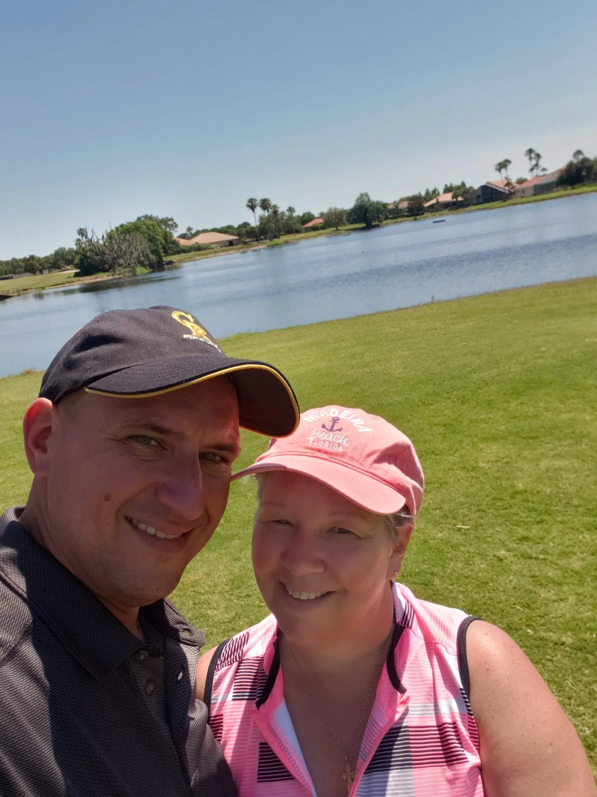 Christopher Radanovic enjoying a round of golf with his wife, illustrating the personal freedom that professional bookkeeping provides.
