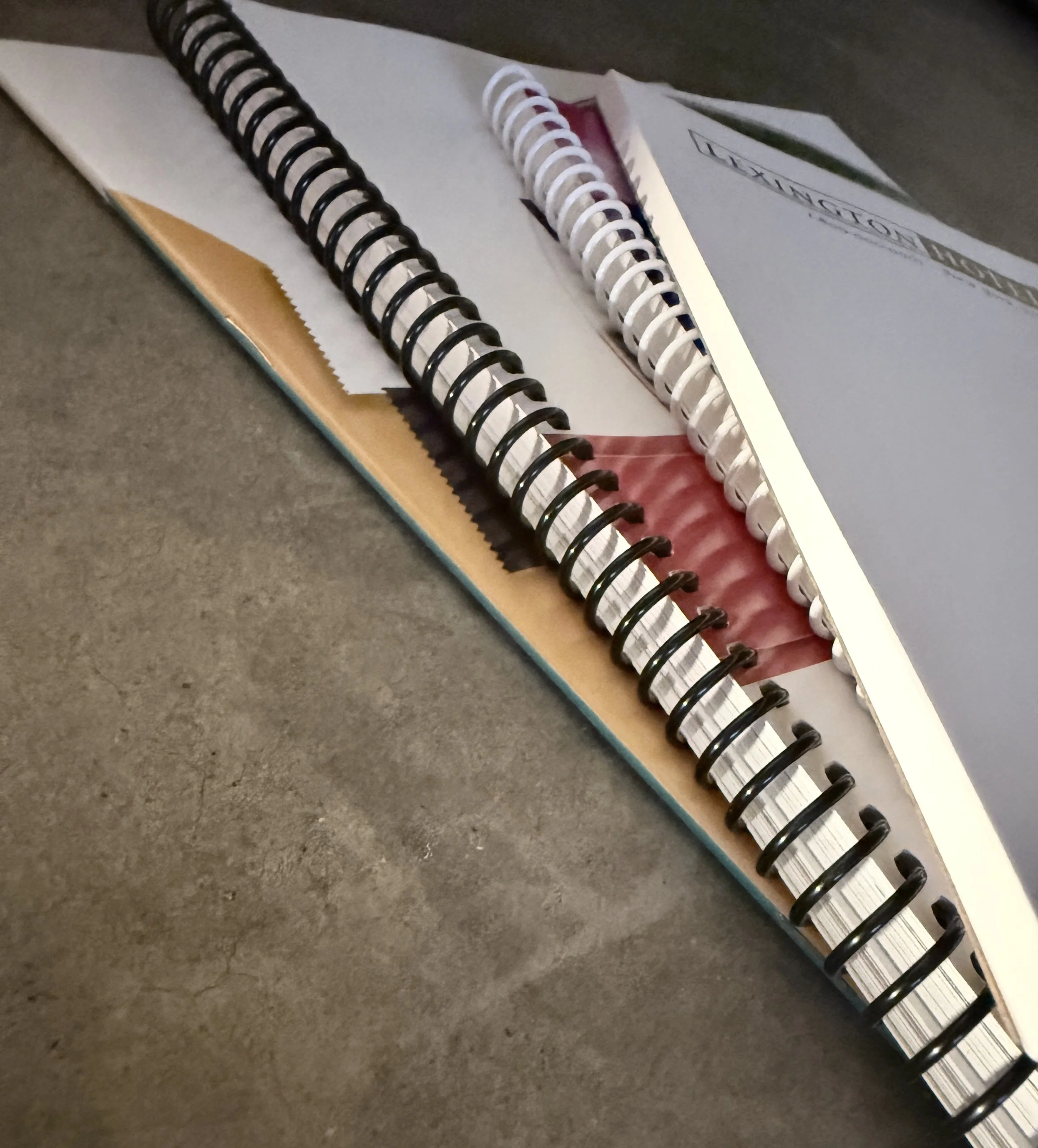 Custom Coil bound, saddle stitch and perfect bound printed books and booklets for professional print and binding services. 