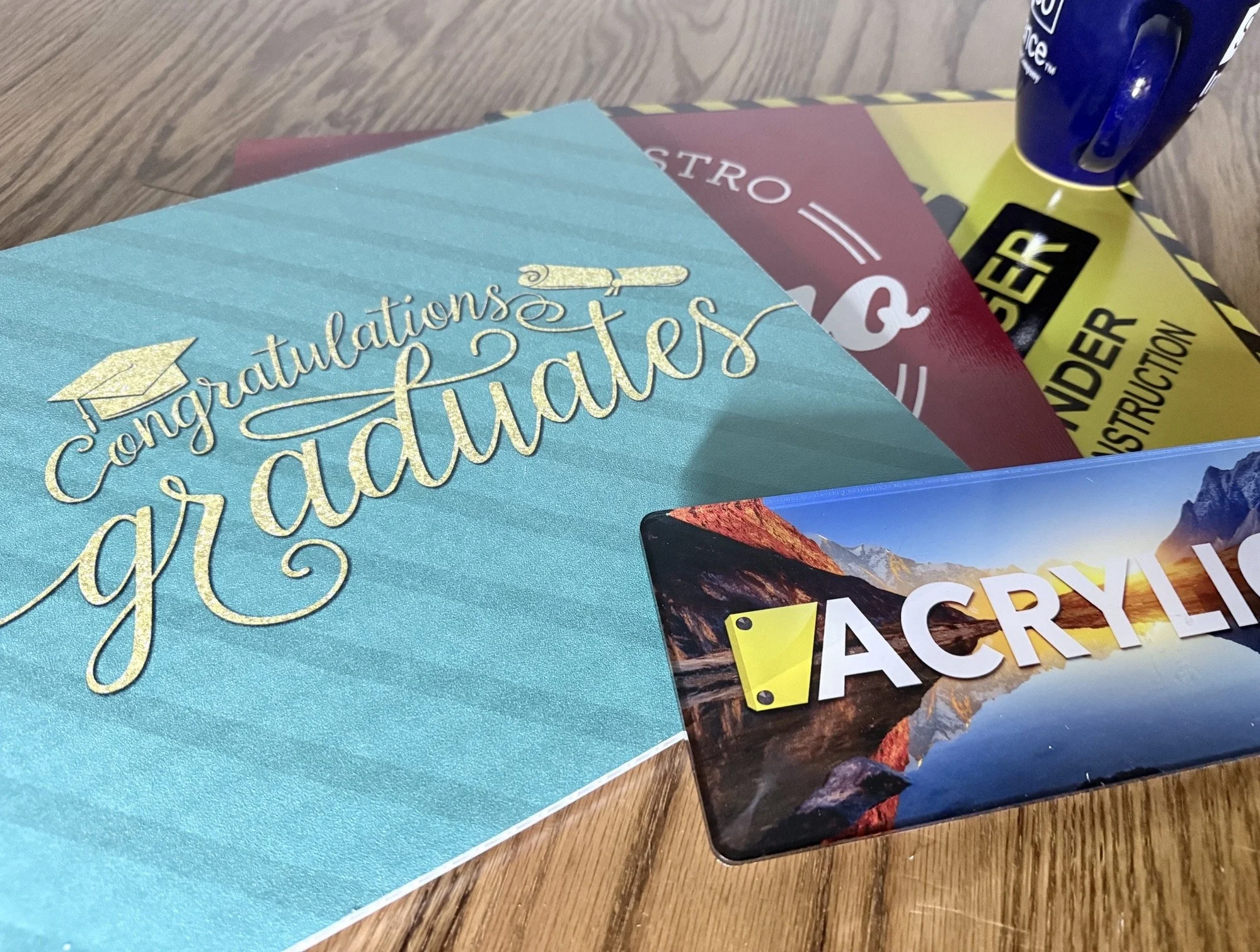 Acrylic, J Board, Metal and PVC samples of premium signage. Large Format Printing