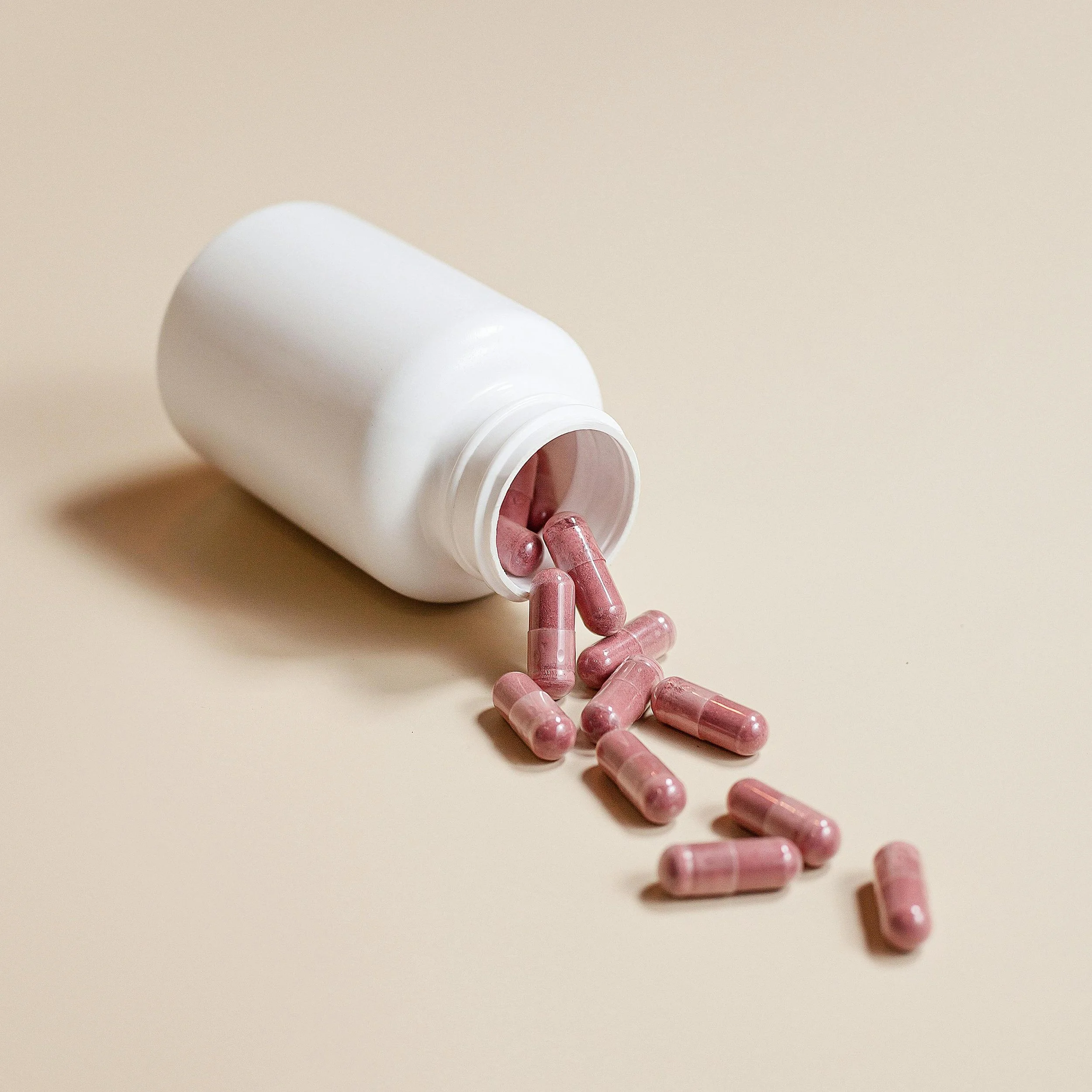 supplements spilling out of a bottle