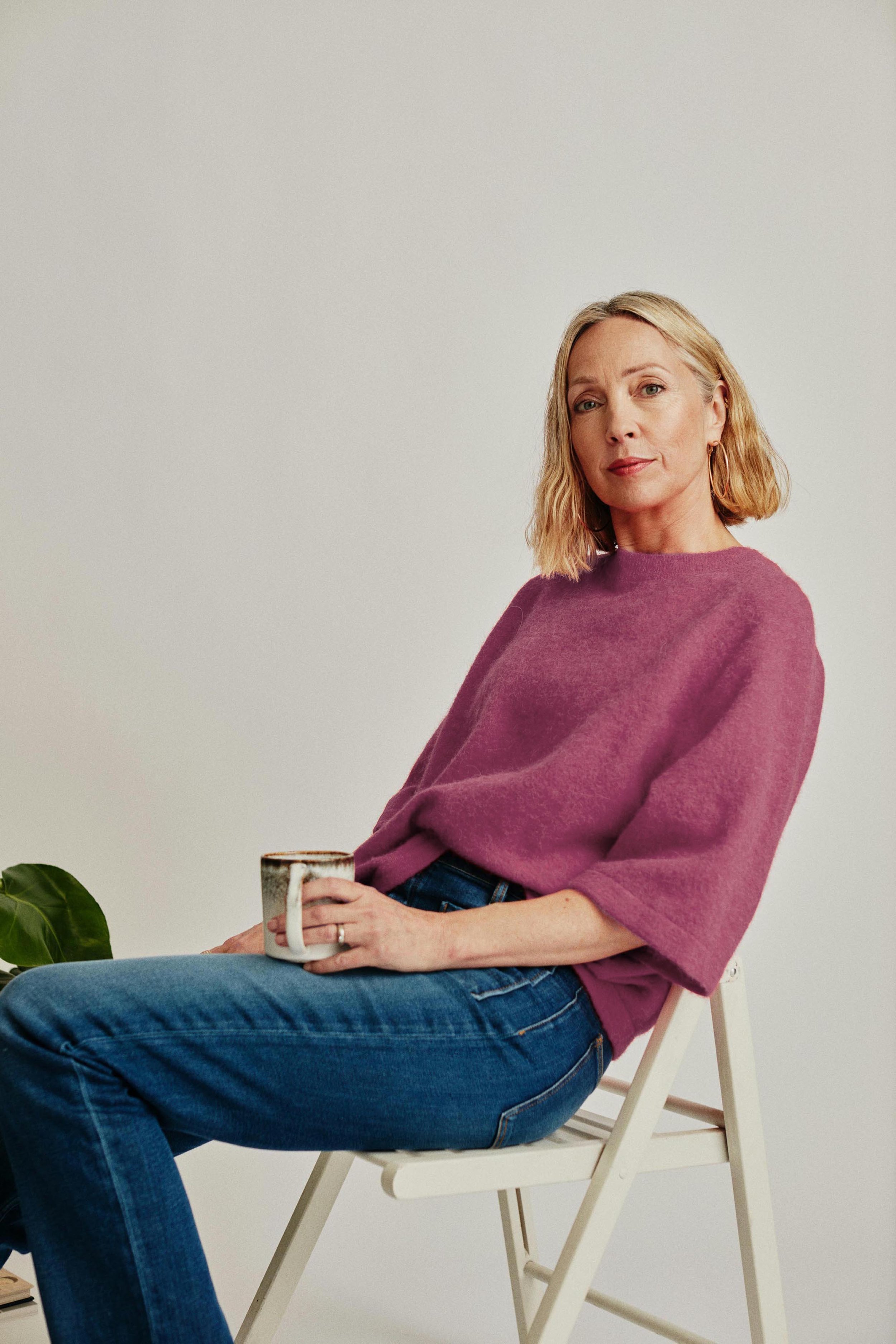 woman leaning back in her chair and looking straight into the camera