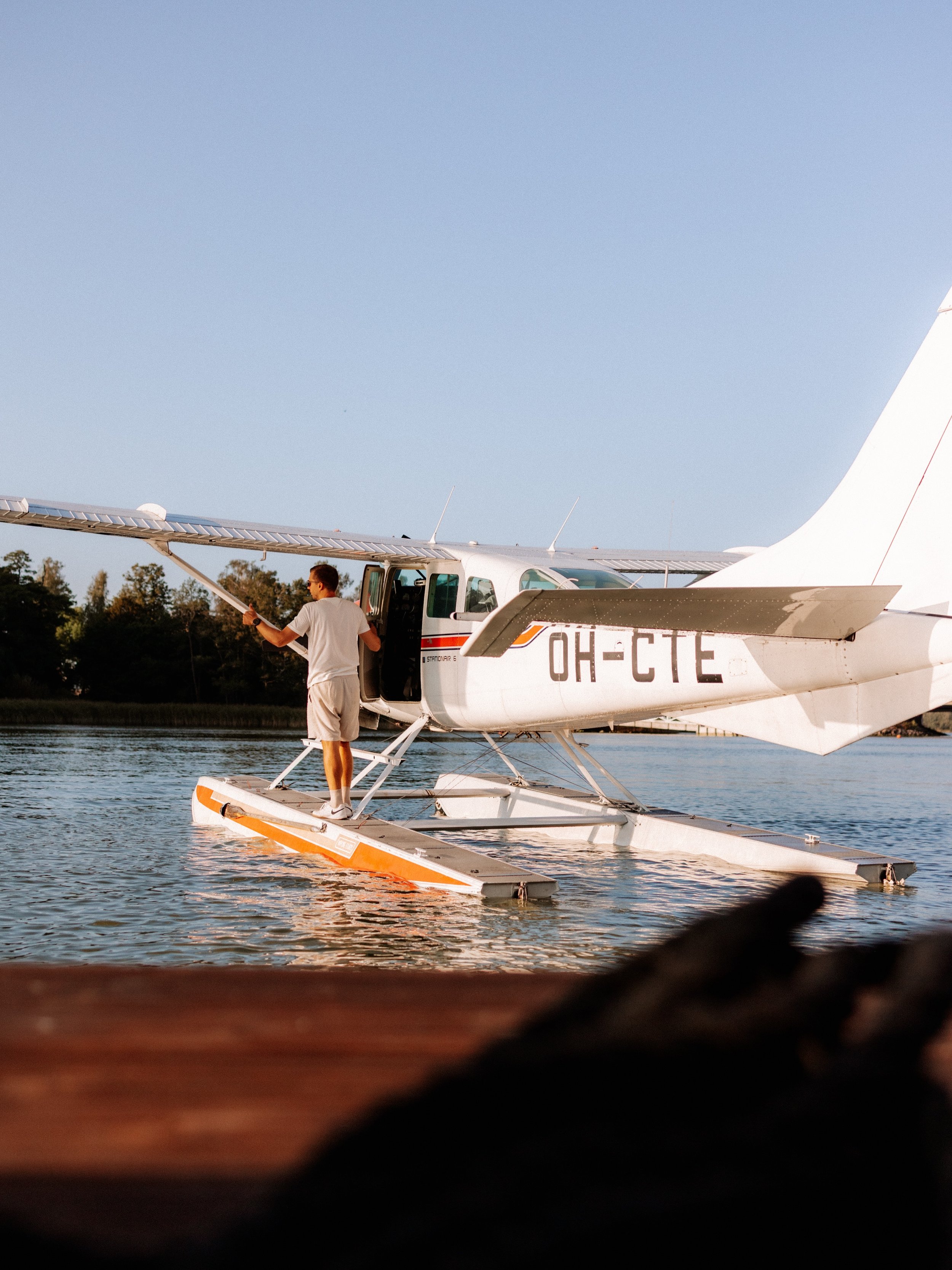 Meet Lari.

When he is not flying, you might find him at the dock next to Alexandra. His Cessna 206 amphibian takes off and lands on the same waters we cruise, and from above, the archipelago turns into a map of granite, pine and open sea.

The plane
