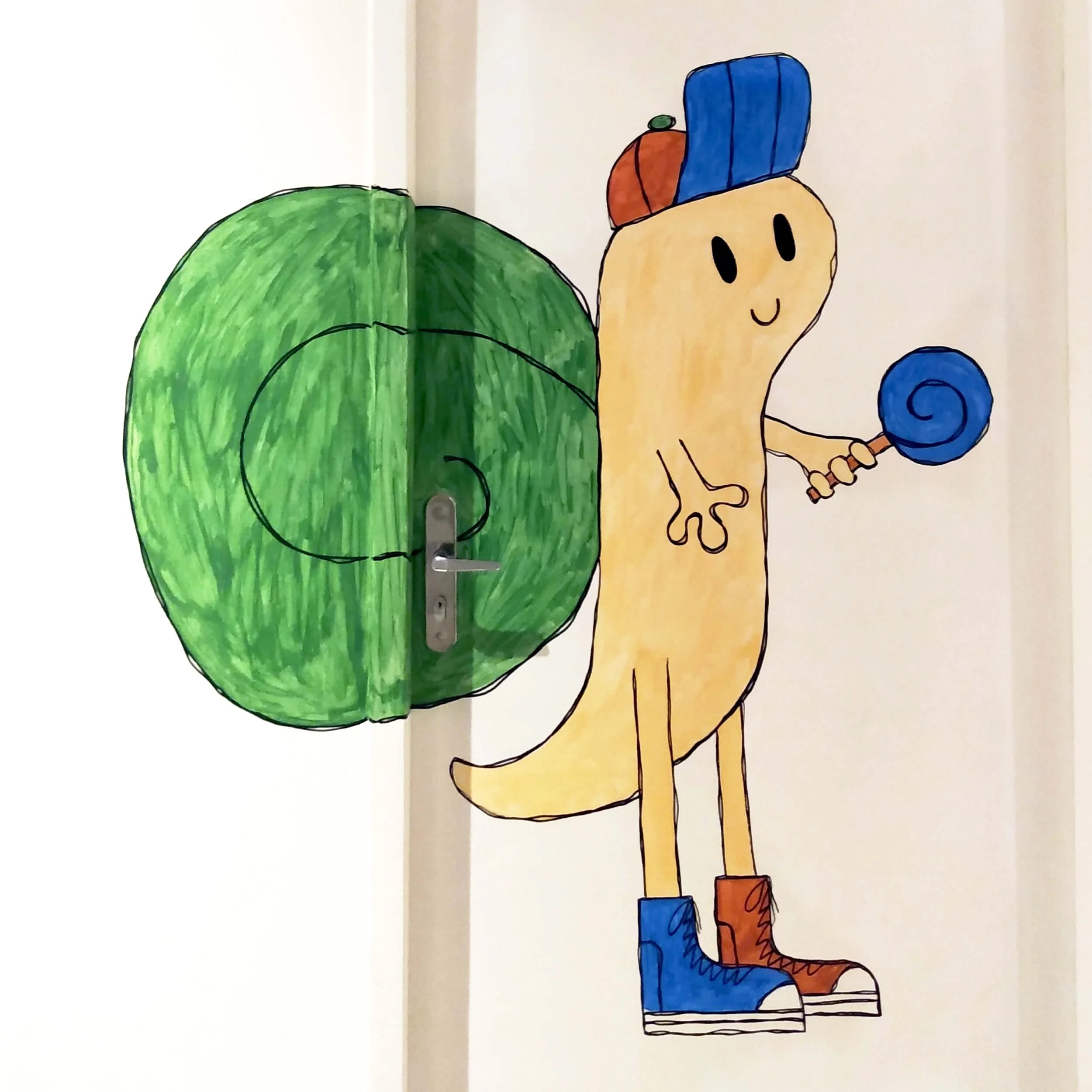 Hand-drawn illustration of a smiling cartoon character with a beige face, black oval eyes, orange and blue hat, orange and blue clothing, blue boots, holding a blue lollipop and standing on striped surface.
