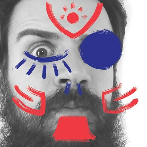 Black and white portrait of a man with a beard and mustache, with colorful, childlike drawings of eyes, a nose, a mouth, and facial features superimposed on his face.