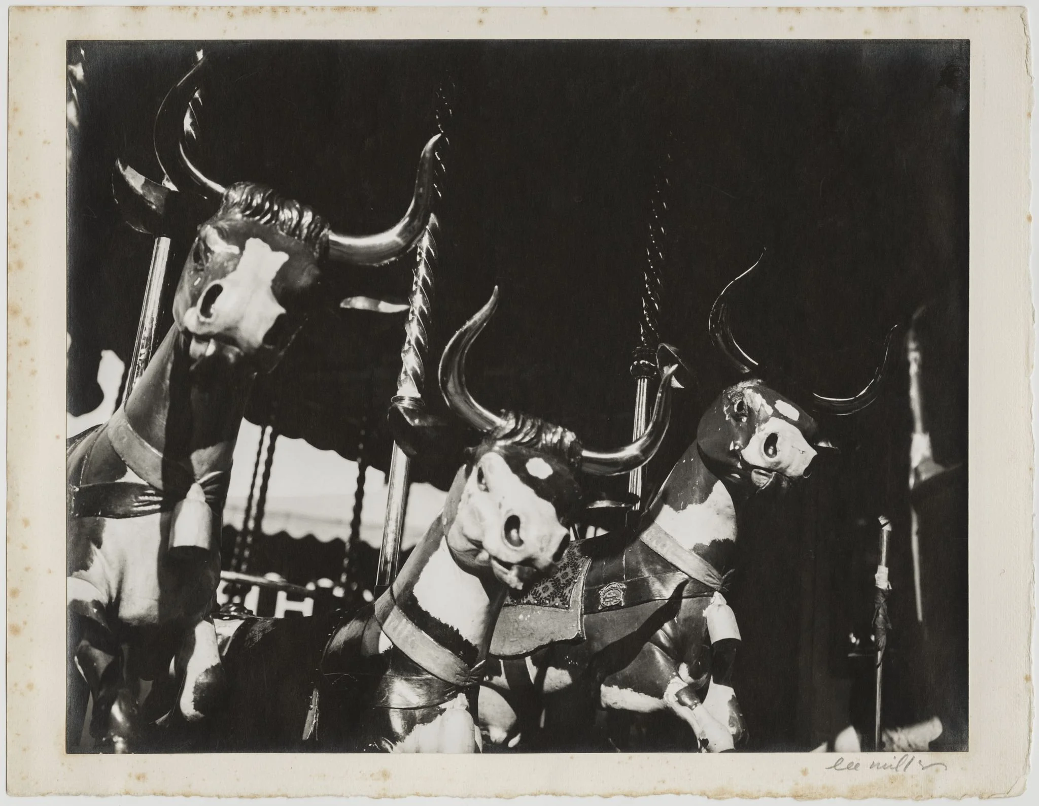 Lee Miller (American, 1907– 1977), Untitled [Carousel Cows], Paris, France, c. 1930, Gelatin silver print, mounted, 9 × 11 1⁄4 inches, Inscriptions, Signature on lower right on recto of mount, Studio stamp on verso of mount;
Provenance:
Christie’s, N