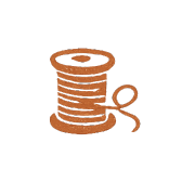 Line of brown thread spools with loose end